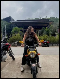 Riding motorcycle Avery Cyrus